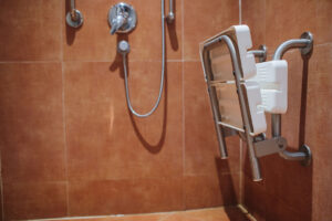 A roll-in shower with a built-in safety seat